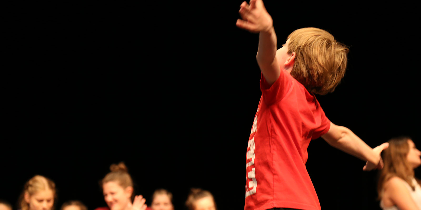 kids performing in a stage play