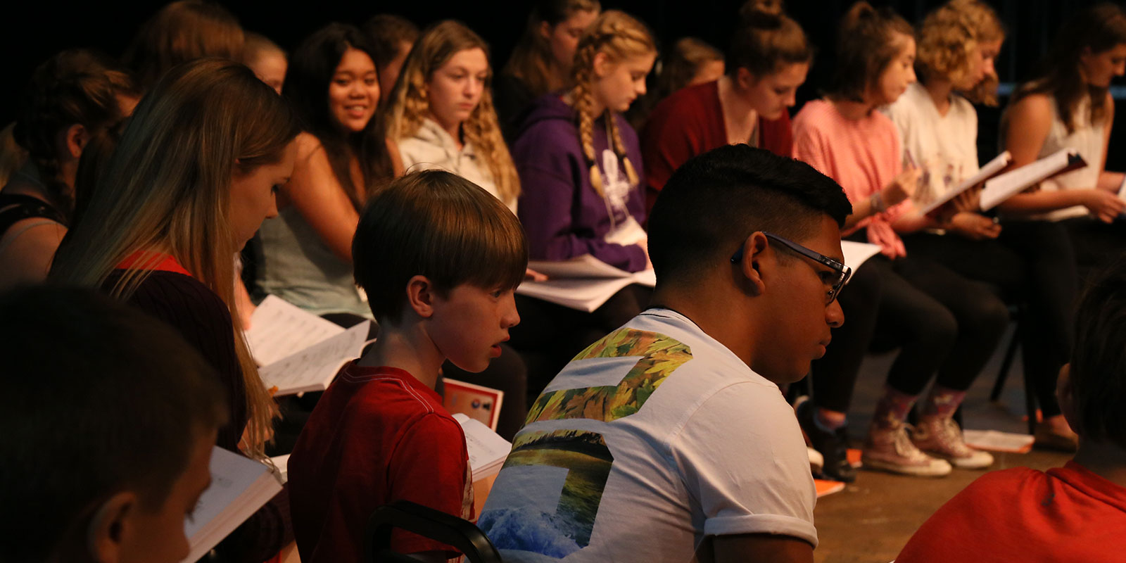 Youths reviewing a play book