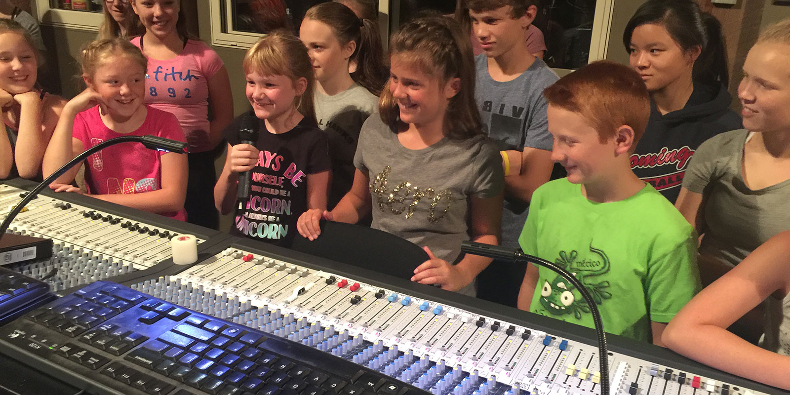 group of kids in a recording studio