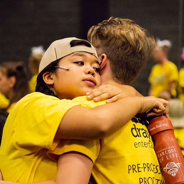 two students hugging