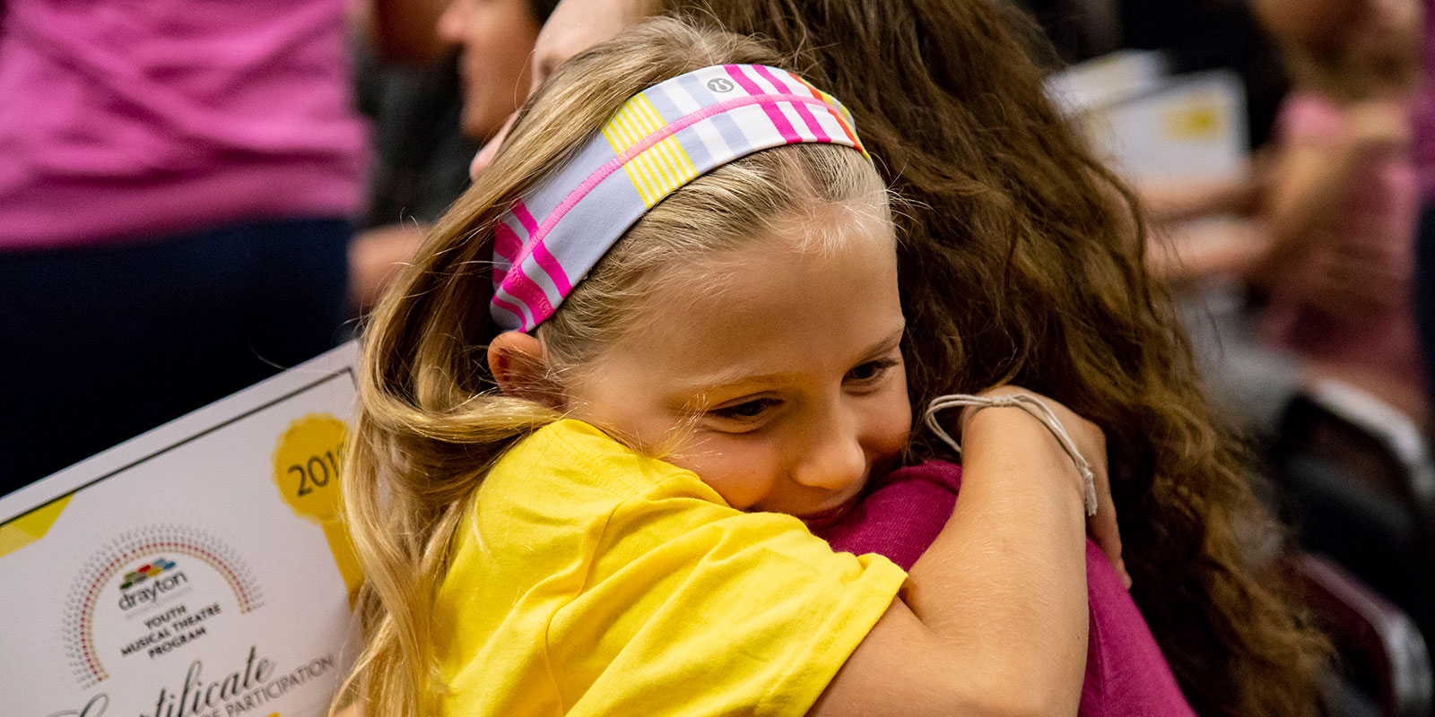 girl hugging a woman