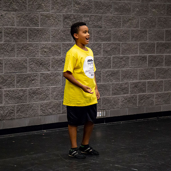 boy with yellow shirt