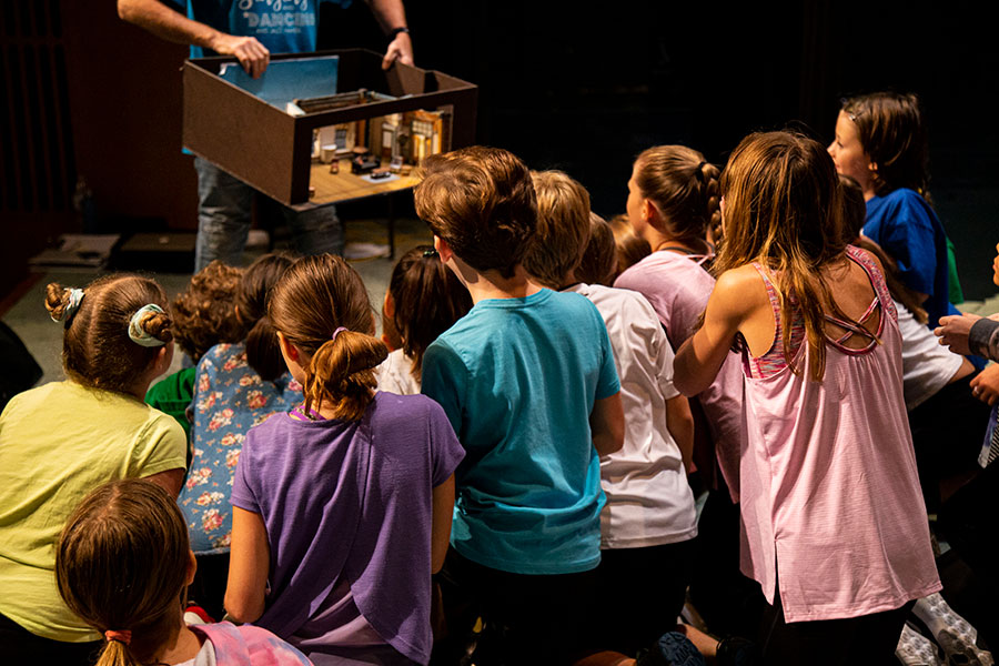 group of kids watching a performance