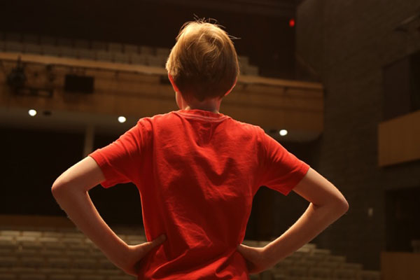 youth facing an empty theatre