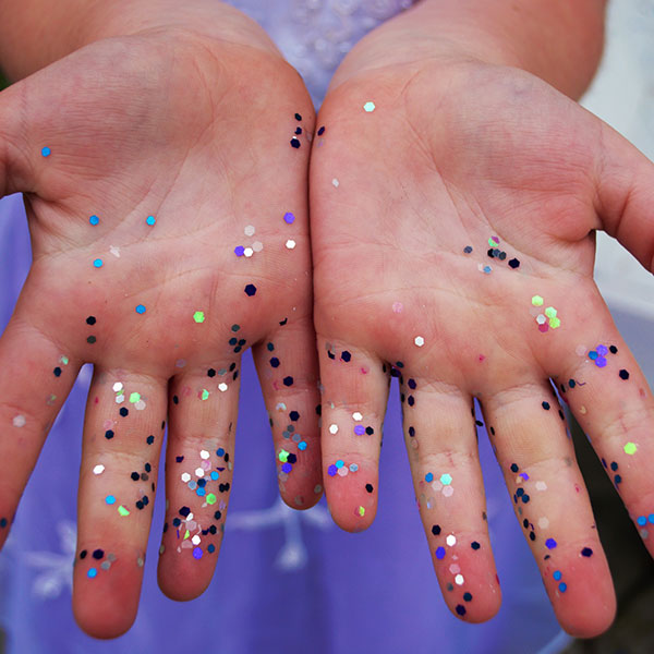 closeup of hands with sparkles