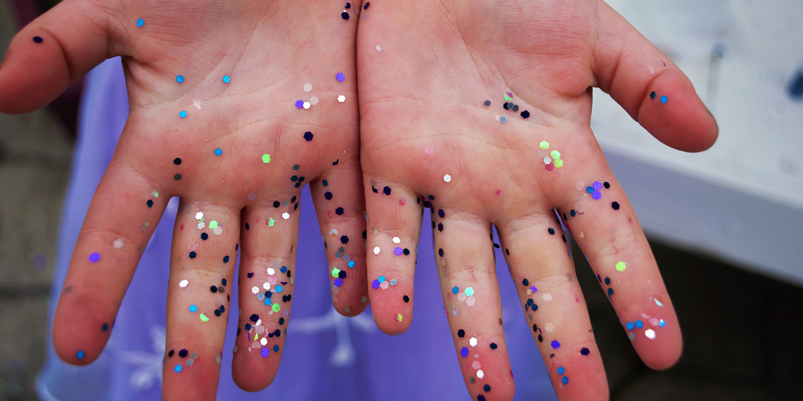 closeup of hands with sparkles