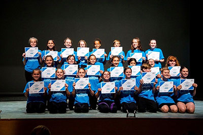 group of kids holding certificates