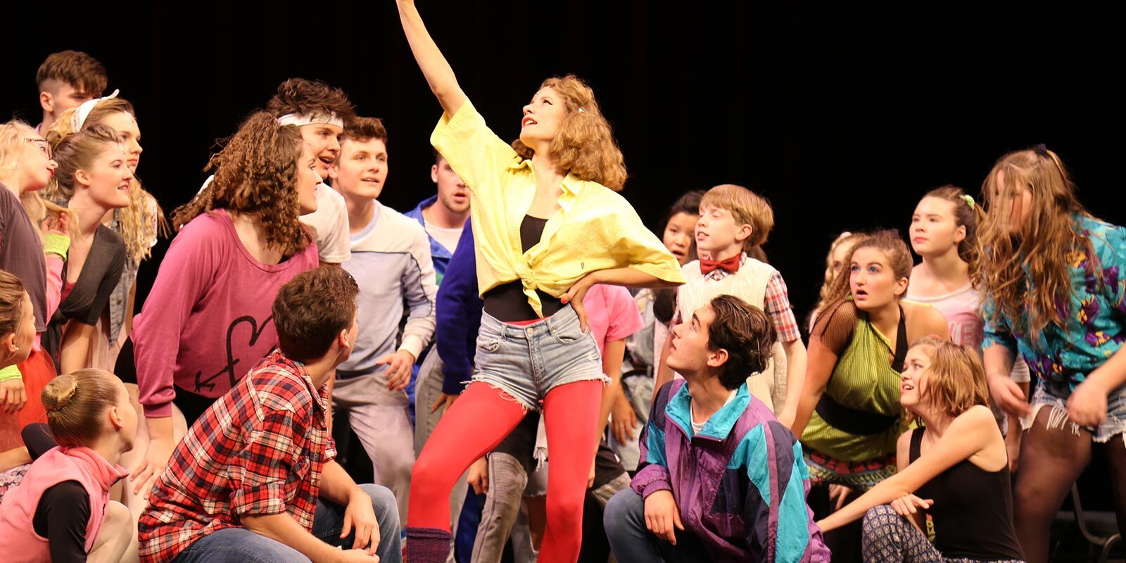 Teens performing in a musical