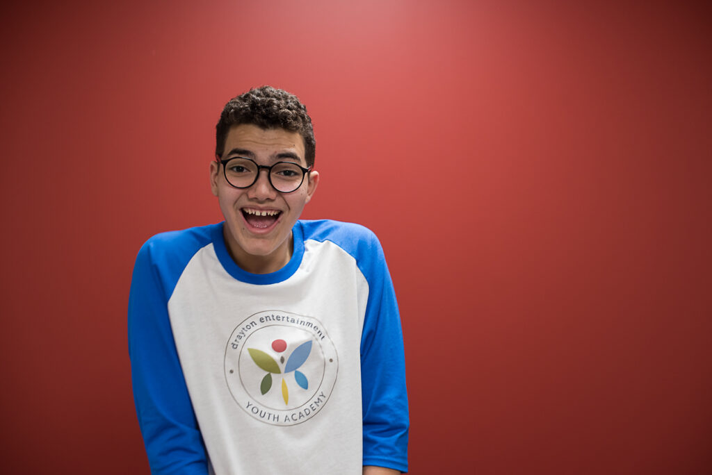 youth wearing blue baseball t-shirt